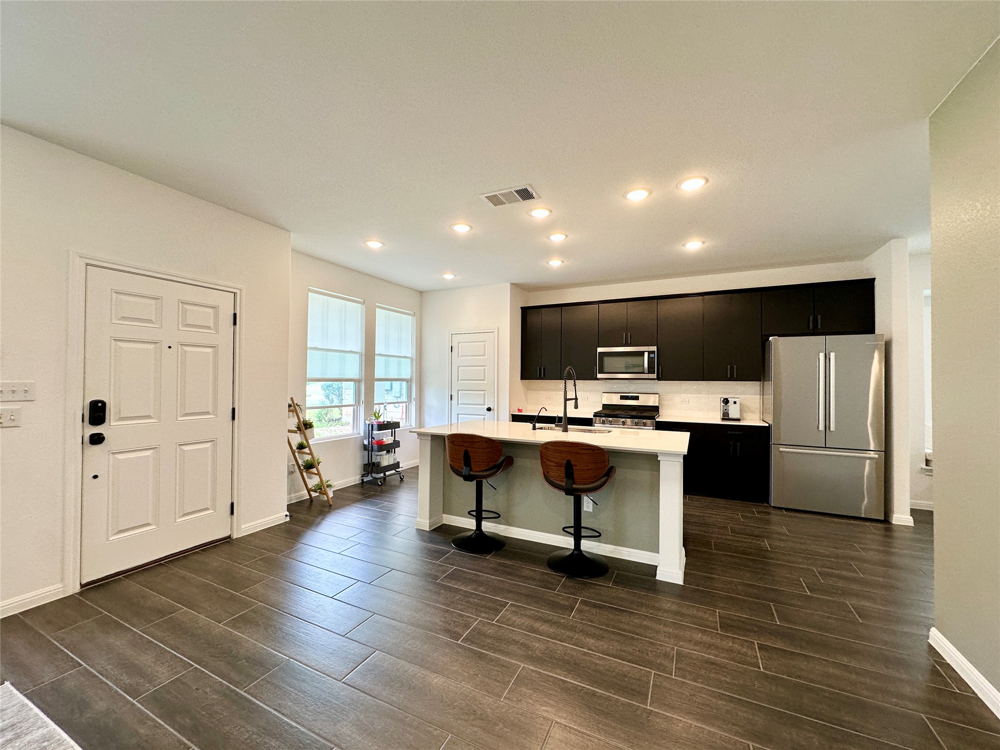 2009 Winston Way Leander, TX 78641 - Photo 2 of 21 a view of kitchen with refrigerator stove microwave and cabinets