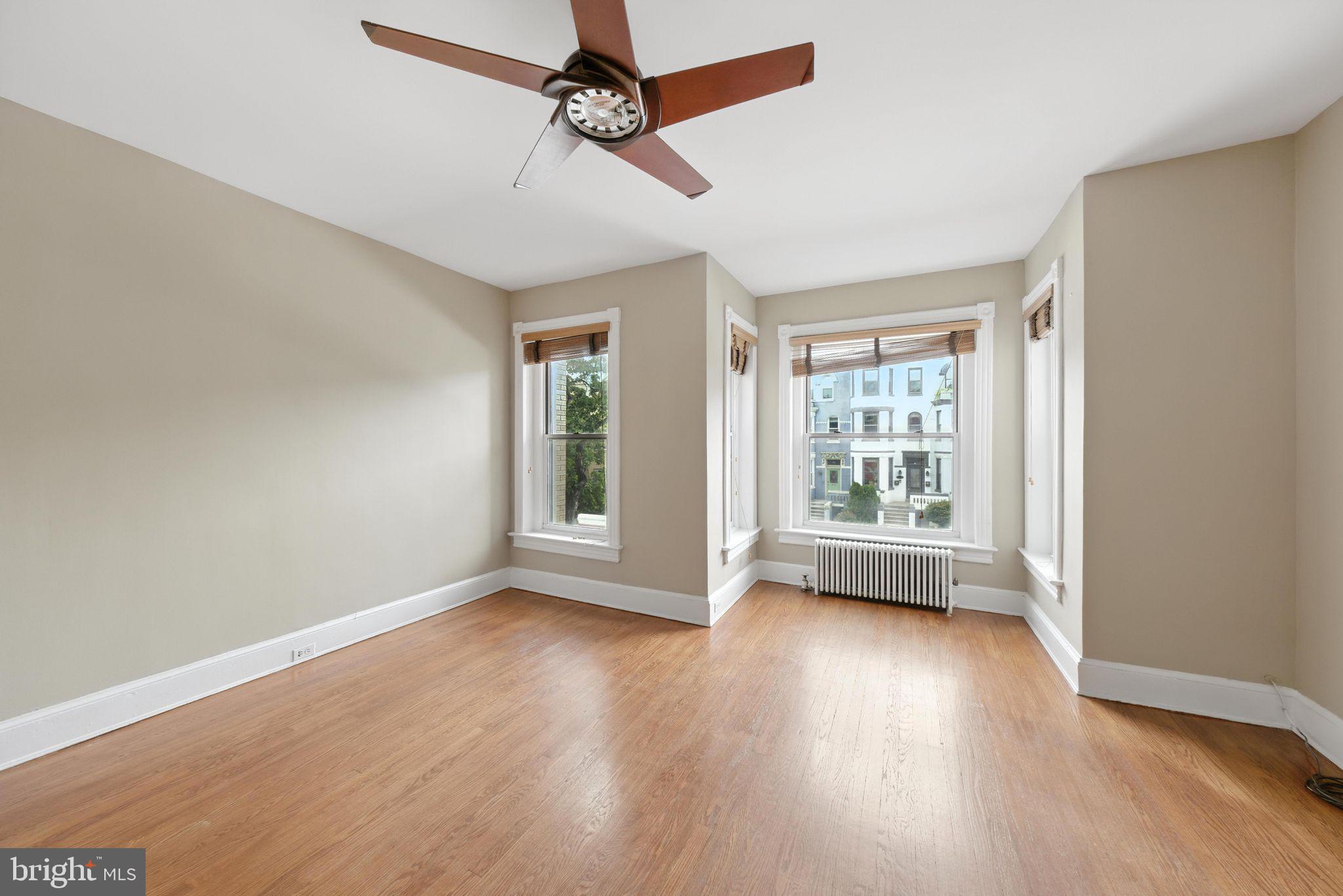 1763 U Street Northwest Washington, DC 20009 - Photo 13 of 29 a view of room with window ceiling fan and hardwood floor