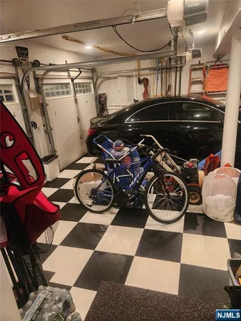 a view of a room with water heater and racks on the wall