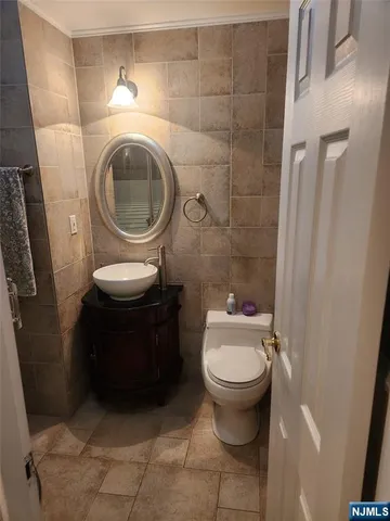 a bathroom with a toilet and a sink