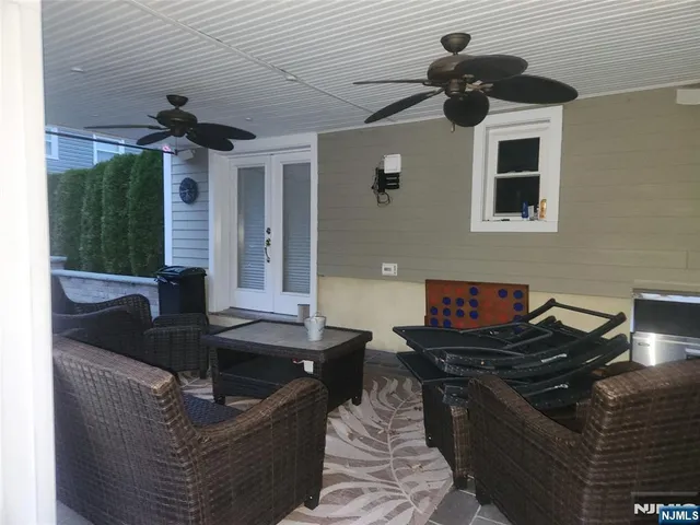 a kitchen with granite countertop a sink stainless steel appliances and cabinets