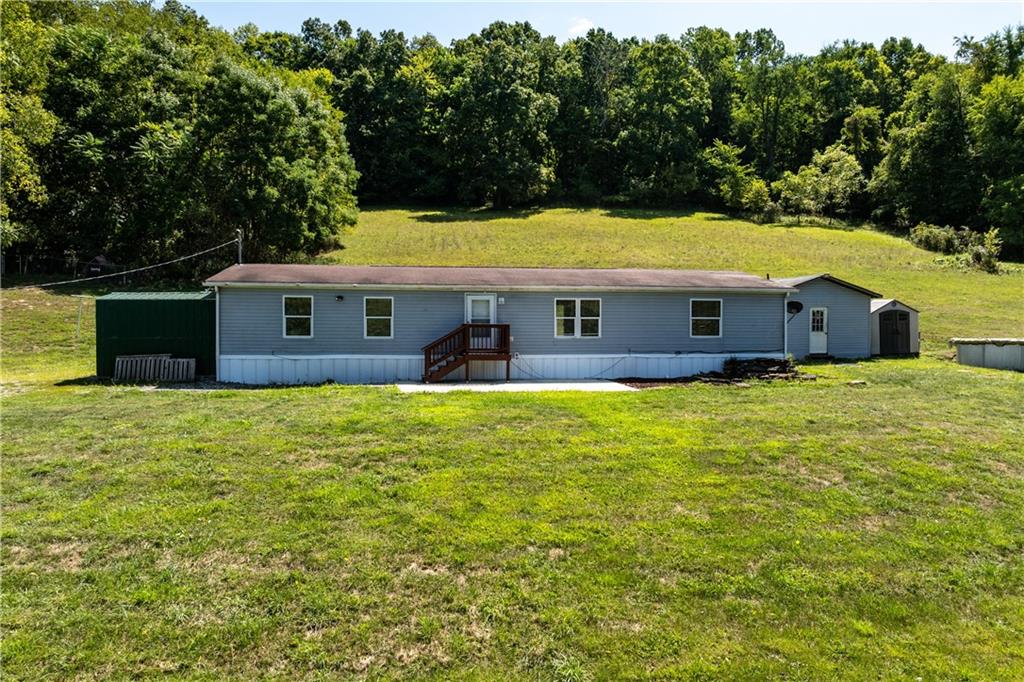 610 Pleasant Valley Road Washington, PA 15301 - Photo 1 of 27 a view of a house with a swimming pool
