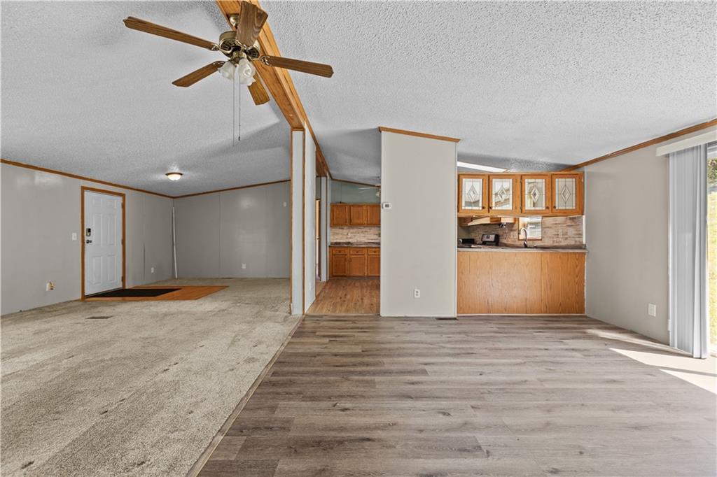610 Pleasant Valley Road Washington, PA 15301 - Photo 12 of 27 a view of a kitchen with a refrigerator a ceiling fan and a refrigerator