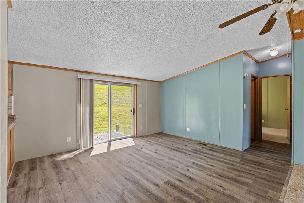 610 Pleasant Valley Road Washington, PA 15301 - Photo 14 of 27 a view of an empty room with wooden floor and a window
