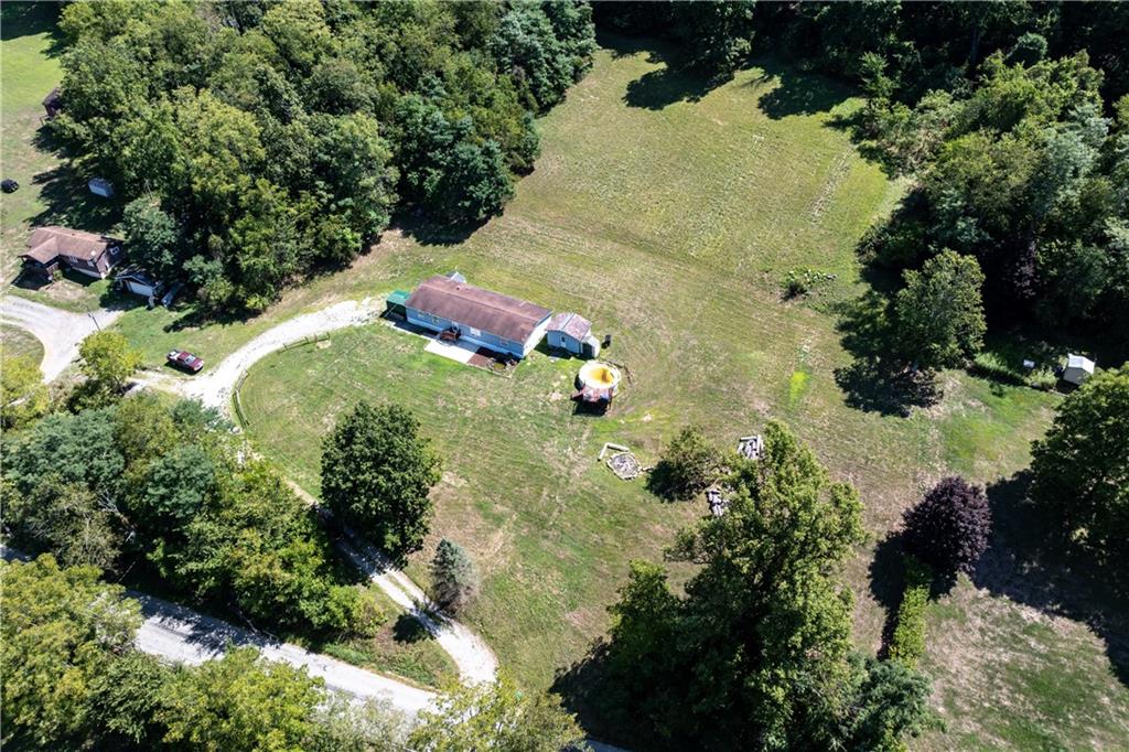 610 Pleasant Valley Road Washington, PA 15301 - Photo 2 of 27 an aerial view of a house with a yard and large trees