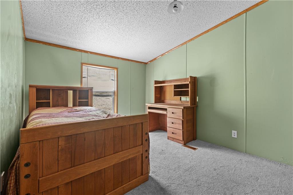 610 Pleasant Valley Road Washington, PA 15301 - Photo 21 of 27 a bedroom with a bed and a television