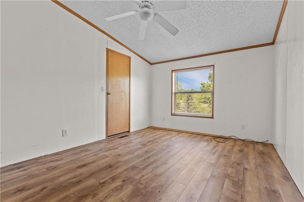 610 Pleasant Valley Road Washington, PA 15301 - Photo 23 of 27 a view of an empty room with a window and wooden floor