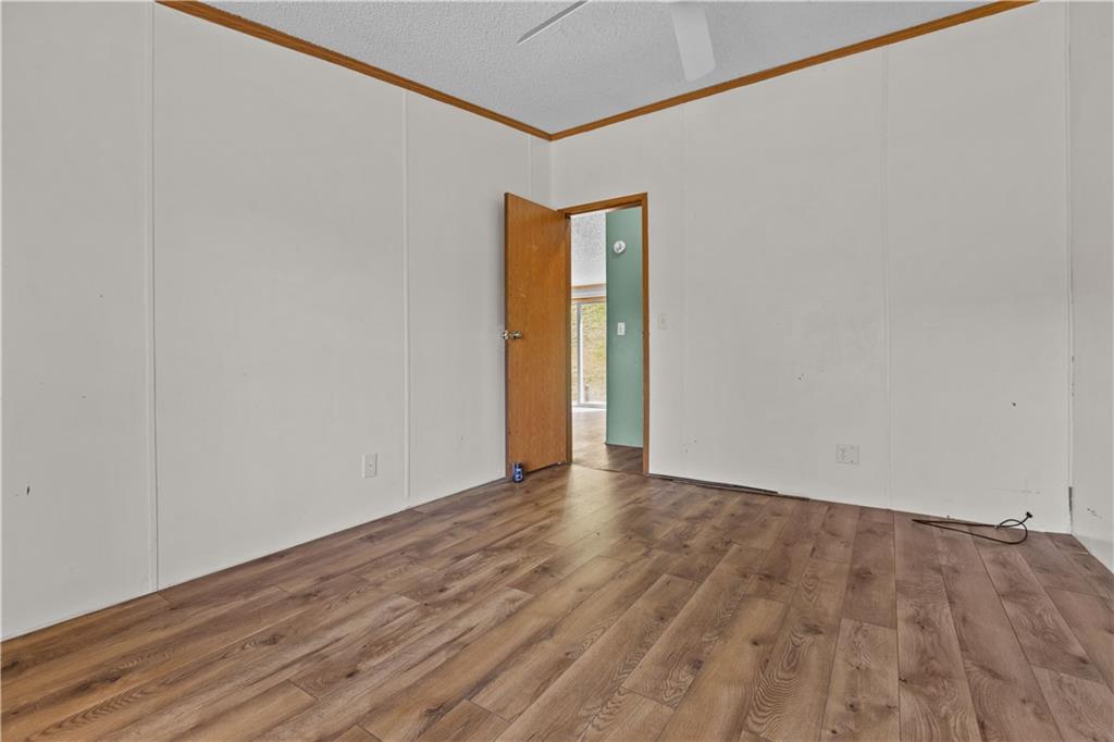 610 Pleasant Valley Road Washington, PA 15301 - Photo 24 of 27 a view of an empty room with wooden floor and a window