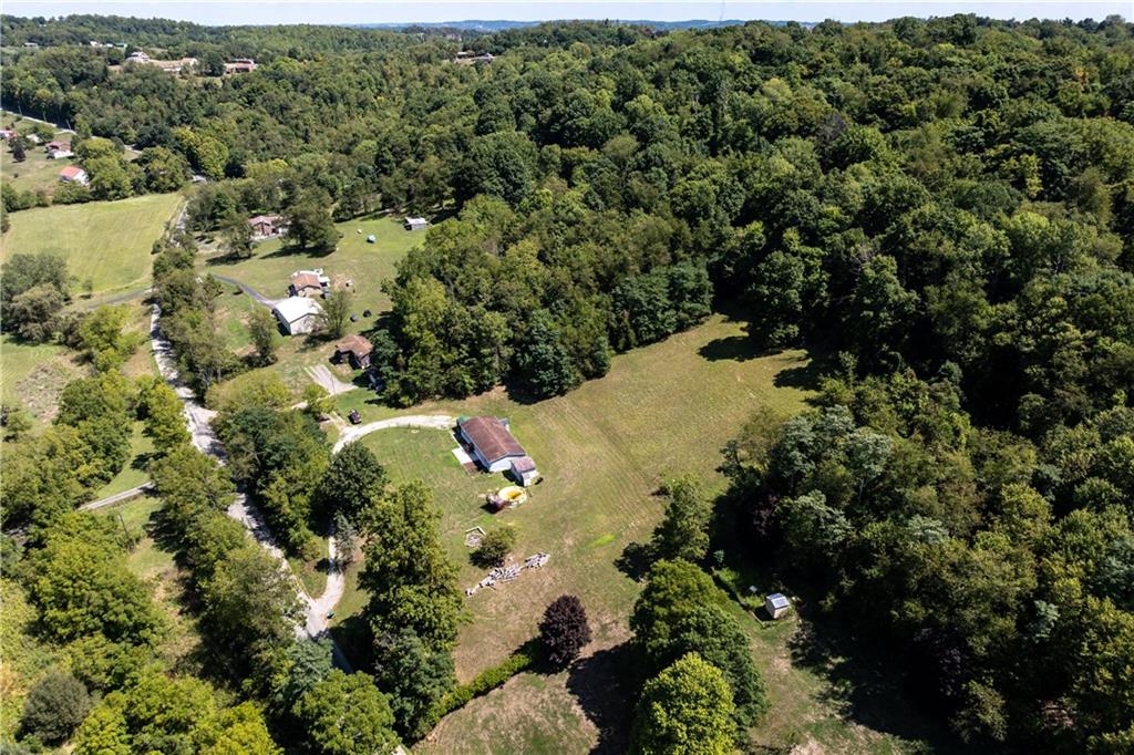 610 Pleasant Valley Road Washington, PA 15301 - Photo 4 of 27 an aerial view of a house with a yard