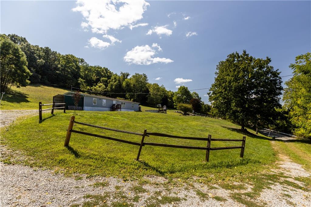 610 Pleasant Valley Road Washington, PA 15301 - Photo 5 of 27 a garden with trees in the background