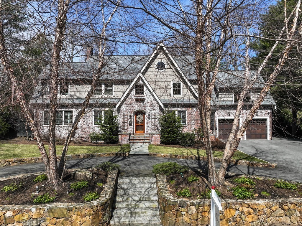 a front view of a house with garden