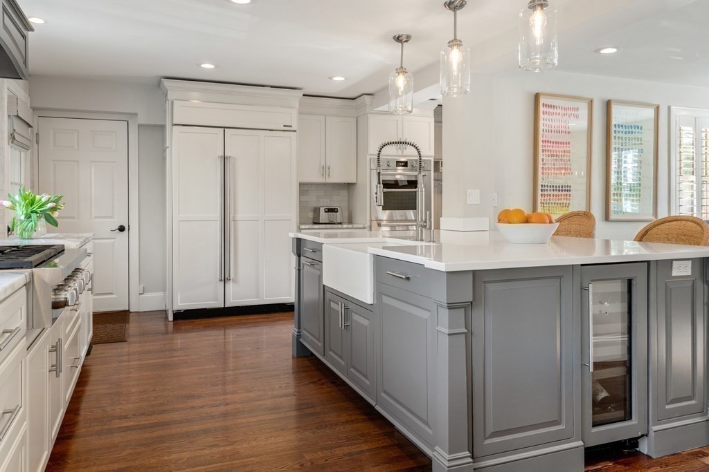 15 Old Town Road Wellesley, MA 02481 - Photo 5 of 30 a large white kitchen with stainless steel appliances granite countertop a lot of counter space and wooden floors