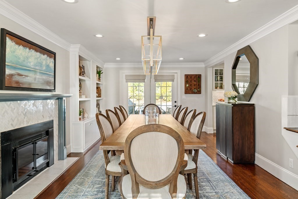 15 Old Town Road Wellesley, MA 02481 - Photo 10 of 30 a dining room with furniture a fireplace and wooden floor
