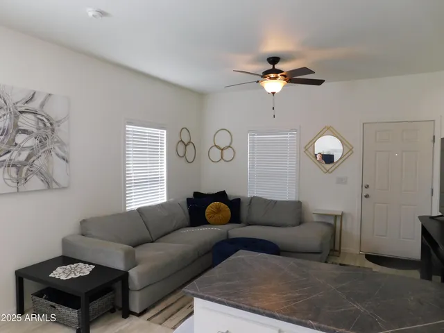 a living room with furniture and a window