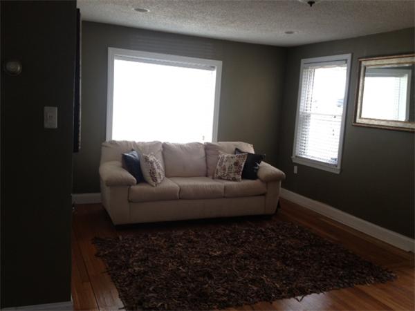 254 Shawmut Street Springfield, MA 01108 - Photo 3 of 21 a living room with furniture and a window