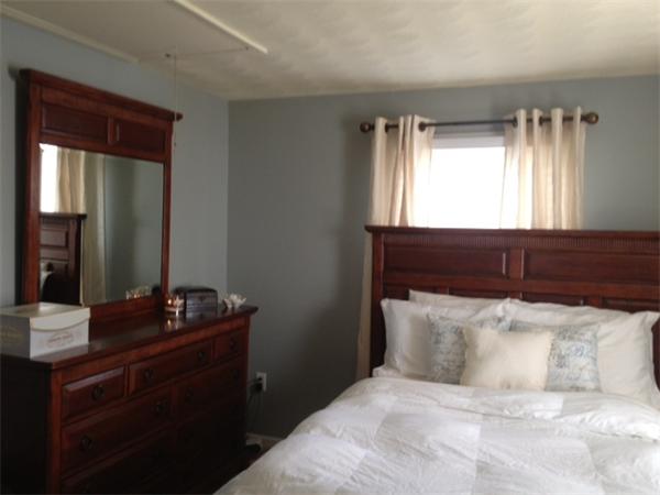 254 Shawmut Street Springfield, MA 01108 - Photo 4 of 21 a bedroom with a bed and a dresser