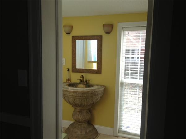 254 Shawmut Street Springfield, MA 01108 - Photo 6 of 21 a bathroom with a sink toilet and mirror