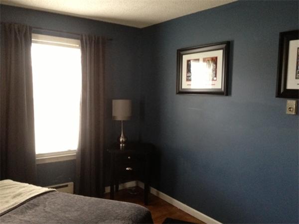 254 Shawmut Street Springfield, MA 01108 - Photo 10 of 21 a bedroom with a bed and a window