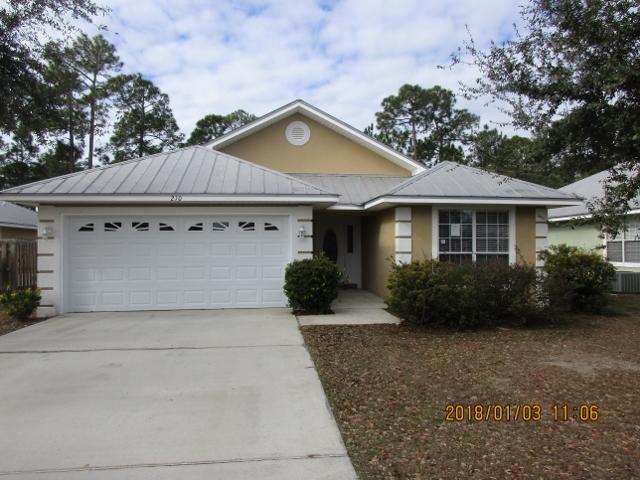 210 South Harborview Road Santa Rosa Beach, FL 32459 - Photo 1 of 12 a front view of a house with garden