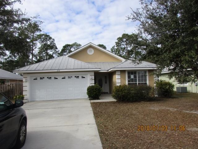 210 South Harborview Road Santa Rosa Beach, FL 32459 - Photo 2 of 12 a front view of a house with a garden