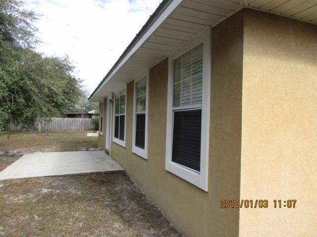 210 South Harborview Road Santa Rosa Beach, FL 32459 - Photo 11 of 12 a view of a back yard of the house