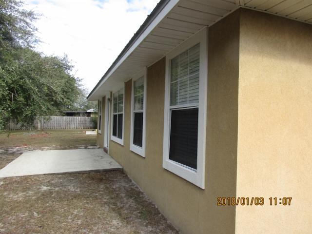 210 South Harborview Road Santa Rosa Beach, FL 32459 - Photo 3 of 12 a view of a back yard of the house