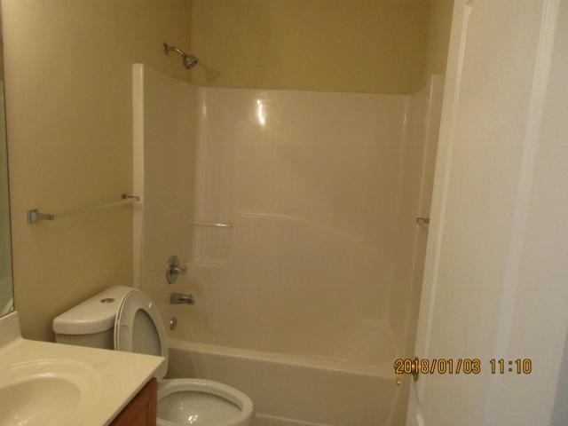 210 South Harborview Road Santa Rosa Beach, FL 32459 - Photo 6 of 12 a bathroom with a sink toilet and shower