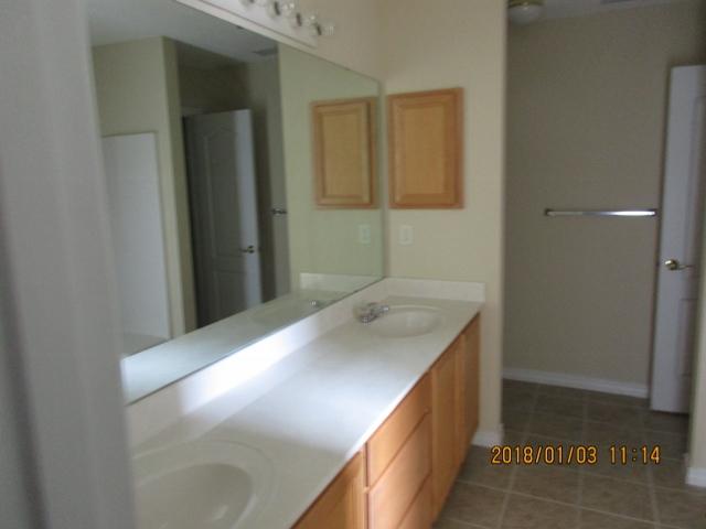 210 South Harborview Road Santa Rosa Beach, FL 32459 - Photo 7 of 12 a bathroom with a sink and a mirror