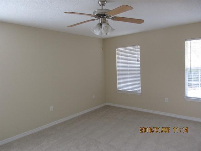 210 South Harborview Road Santa Rosa Beach, FL 32459 - Photo 8 of 12 an empty room with a window and a fan