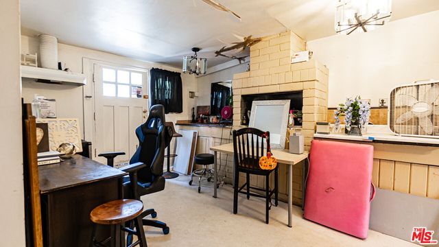 a view of a workspace with furniture