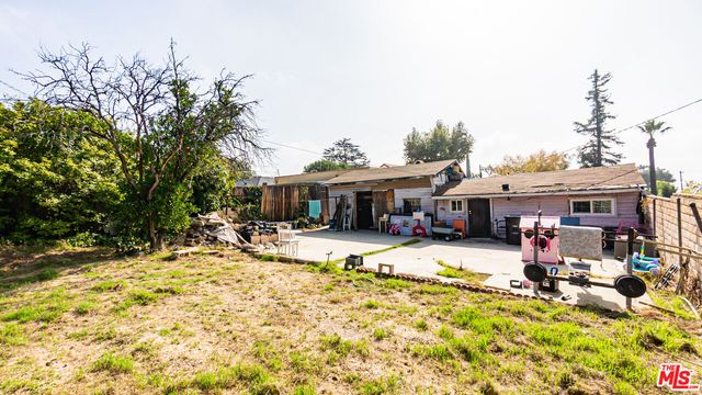 a view of a house with snow on the ground