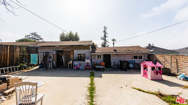 a view of the front of a house with a patio