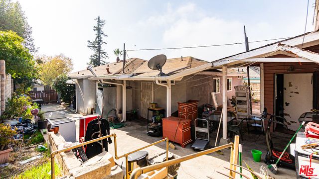 a view of a chairs and table in a patio