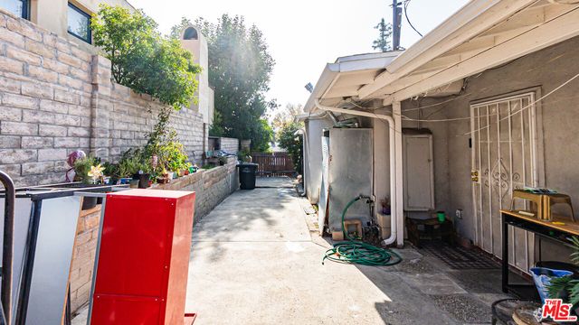 a pathway of a house with a yard