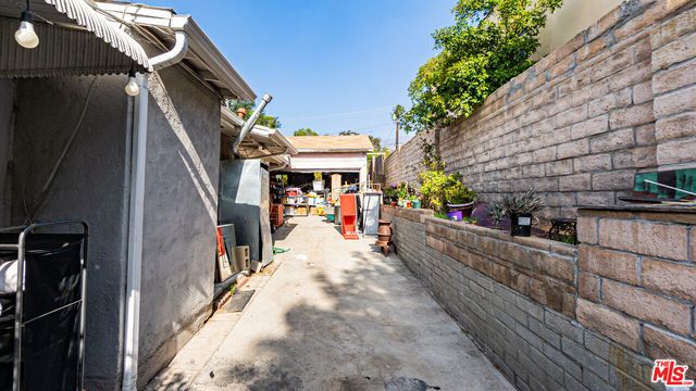 a view of a chairs and table in the balcony