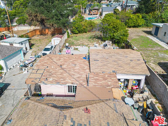 a terrace with outdoor seating and trees