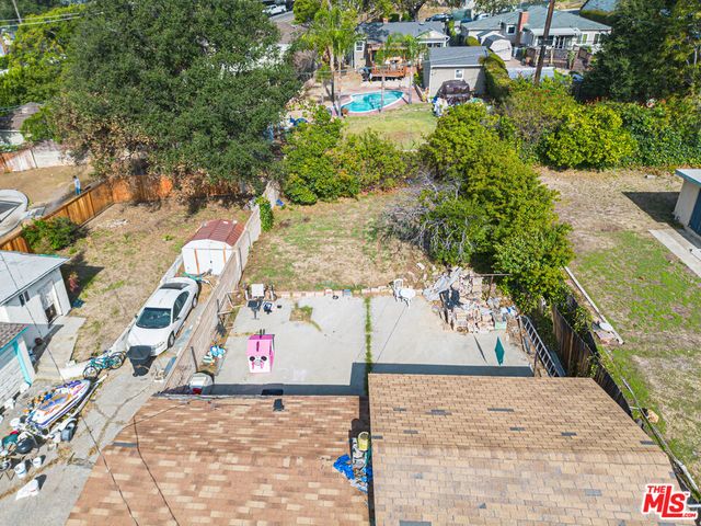an aerial view of a house with a garden