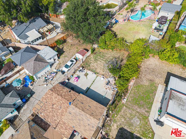 an aerial view of a houses with outdoor space