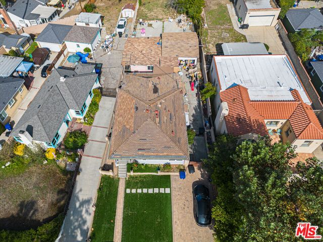 an aerial view of a house with outdoor space