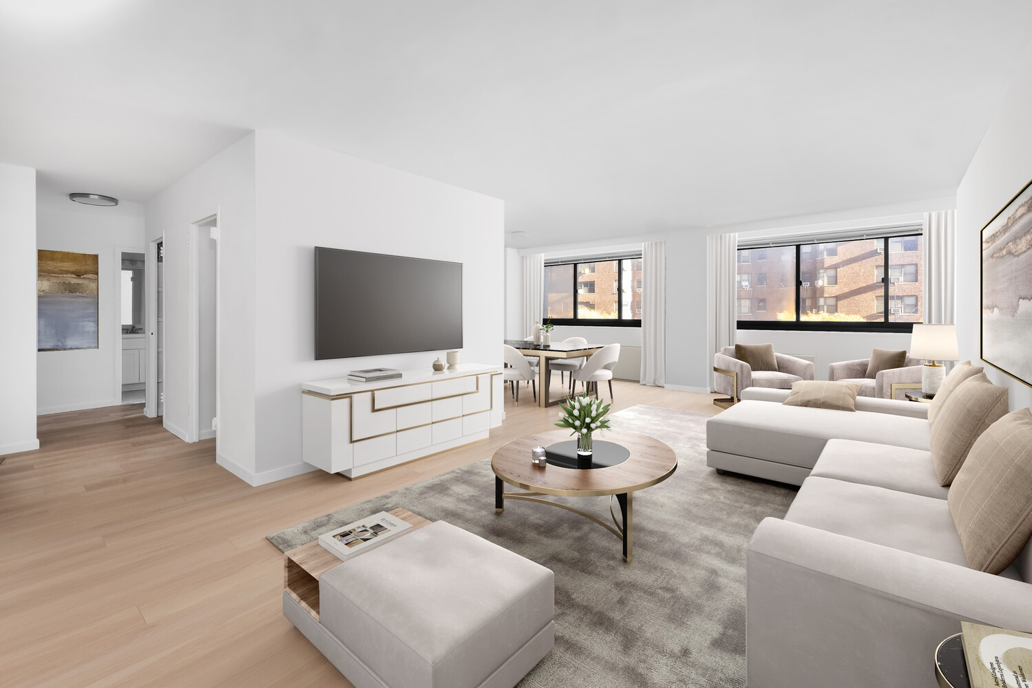 1725 York Avenue, Unit 5E Manhattan, NY 10128 - Photo 1 of 13 a living room with furniture and a flat screen tv