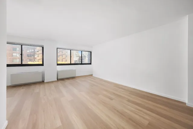 an empty room with windows