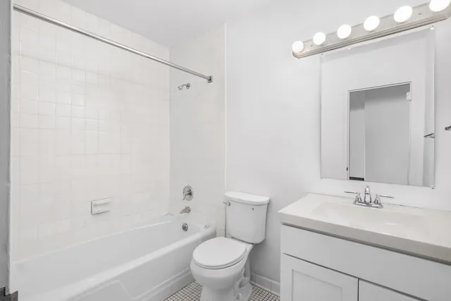 a bathroom with a sink toilet a mirror and shower