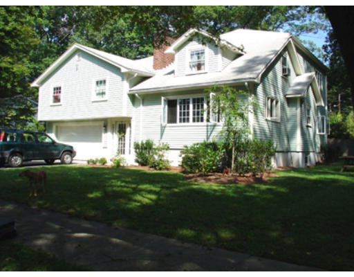 28 Brierfield Road Newton, MA 02461 - Photo 1 of 1 a view of a white house next to a yard with big trees