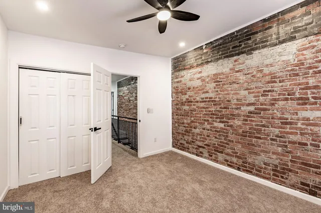 a view of outdoor space with wooden floor and fence