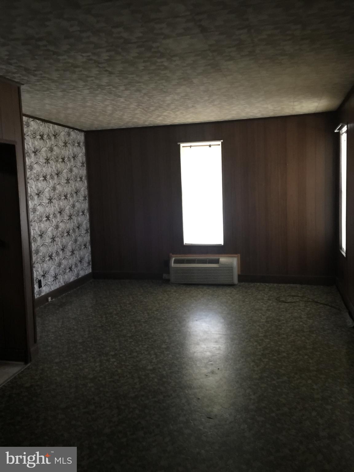 213 Locust Street Hanover, PA 17331 - Photo 5 of 9 an empty room with windows