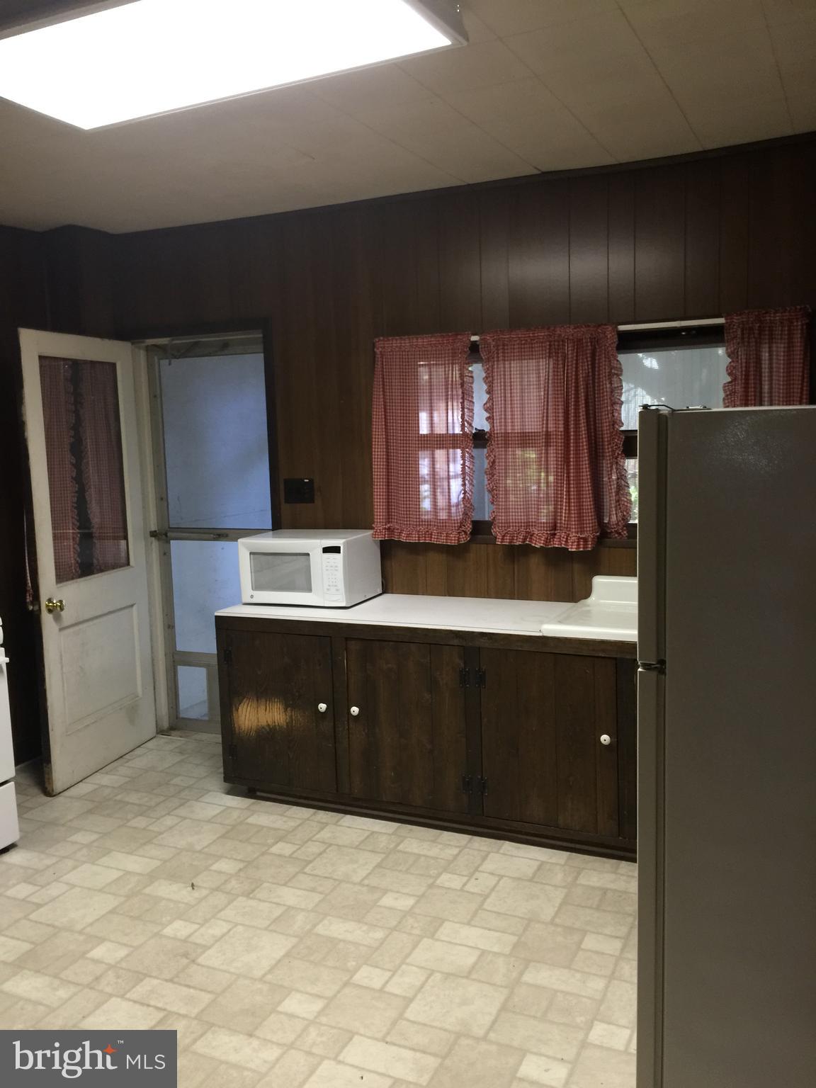 213 Locust Street Hanover, PA 17331 - Photo 6 of 9 a kitchen with a refrigerator and a sink