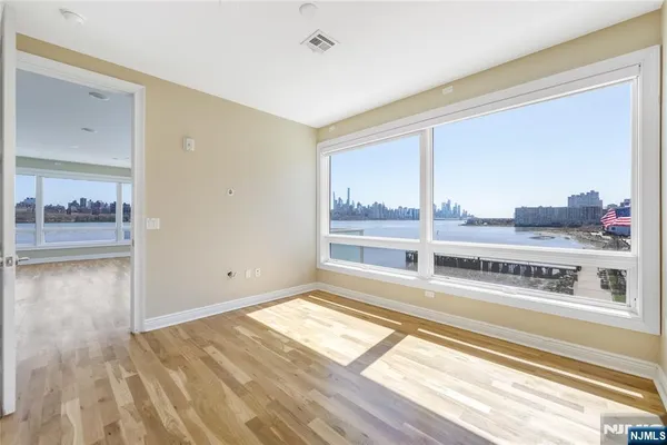 a view of a living room with a large window