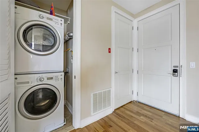 a view of a hallway with washer and dryer