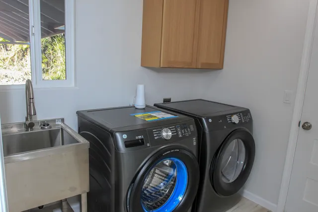 a utility room with dryer and washer