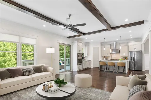 a spacious bedroom with a bed and a large window